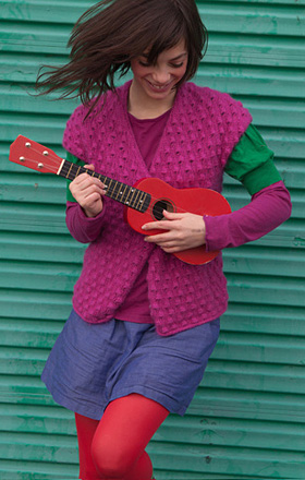 Girl smiling with Ukulele